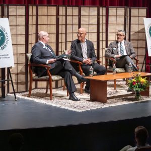 Tom Gabbard, center, speaks with Dean Richard Buttimer (left) and Dean José Gámez at the C-Suite Speaker  event on Feb. 11. Photo by Ryan Honeyman.
