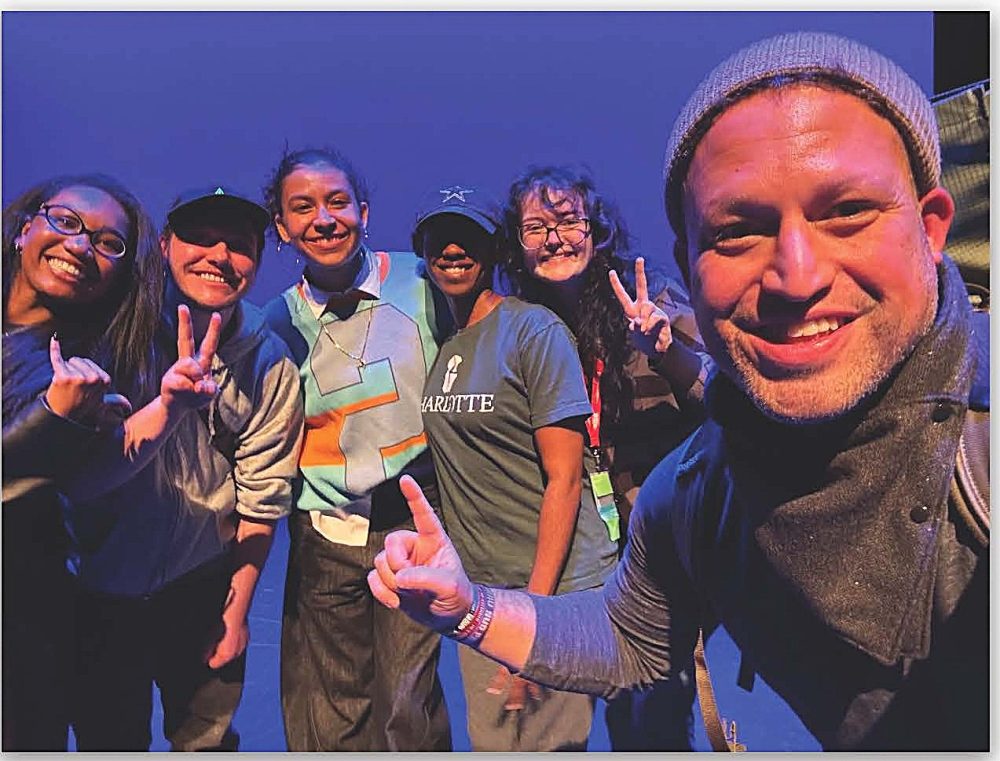 Professor Carlos Cruz with students at the American College Theatre Festival.