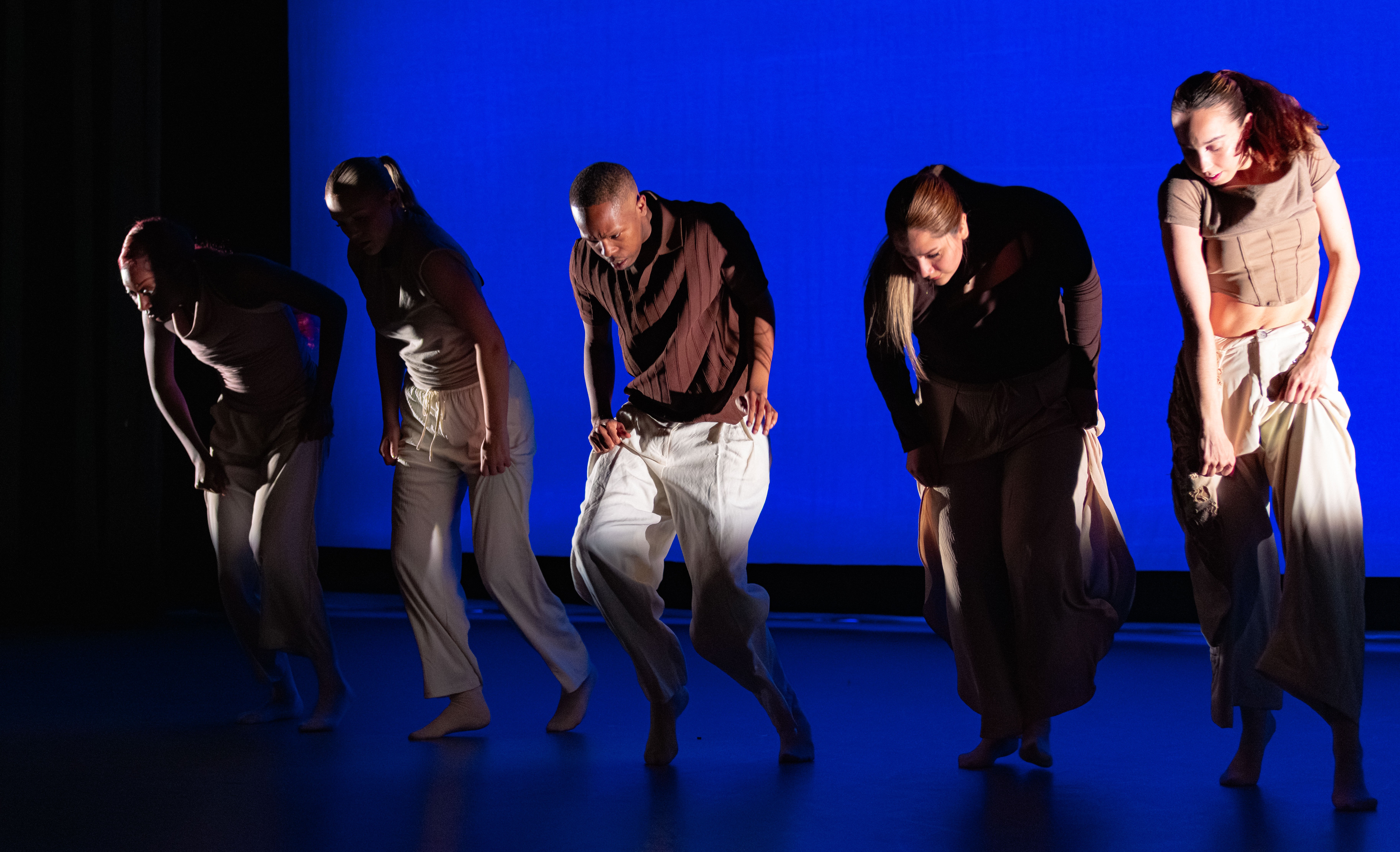 Five dancers performing in Keegan Martin's dance piece, Divergent Pulse.