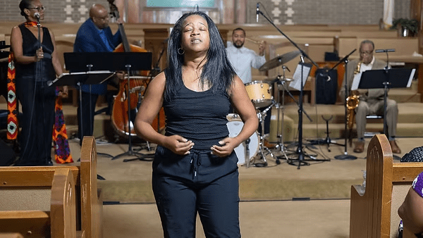 Ashley Tate performing in No Tears